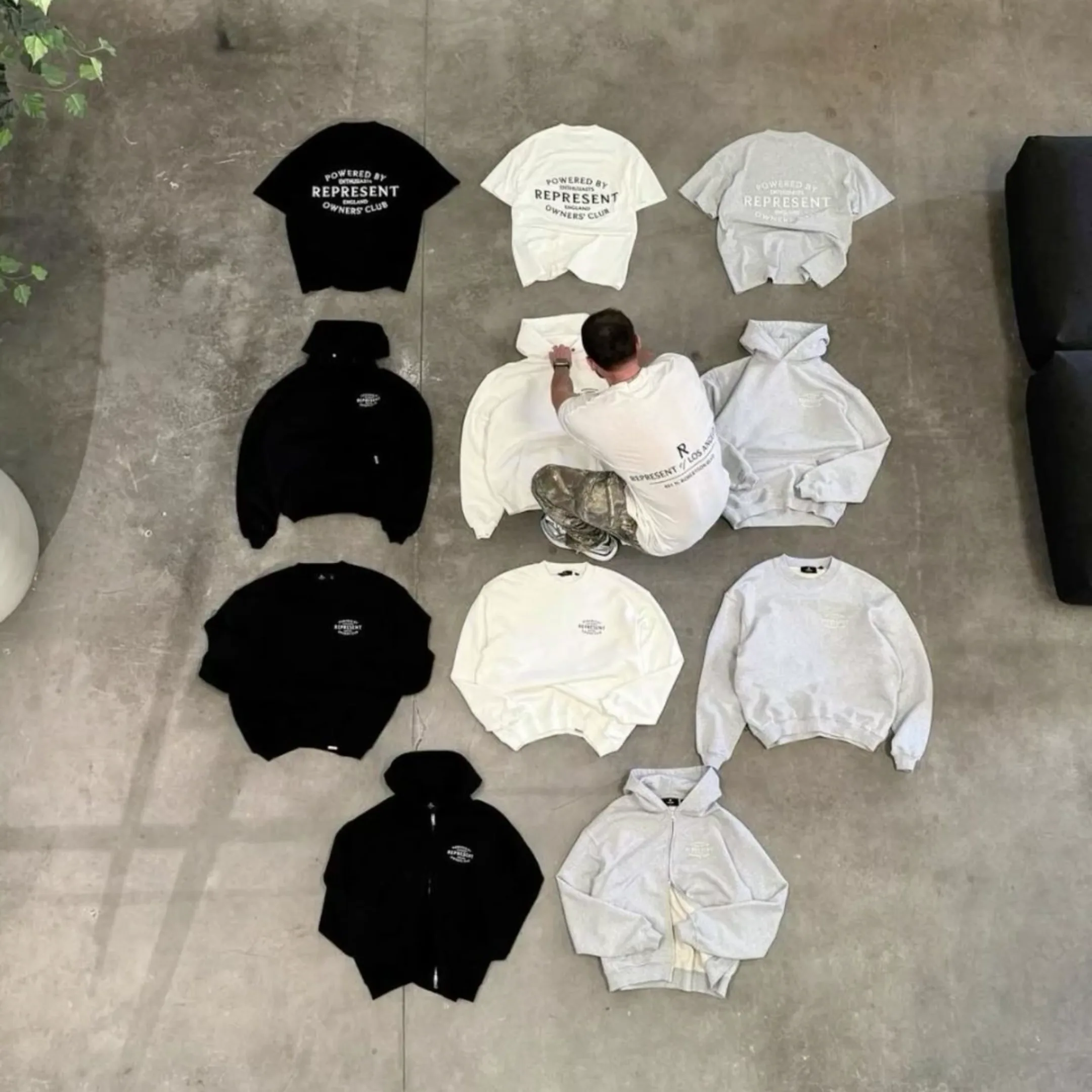 Coordinated collection of printed T-shirts and hoodies arranged for review